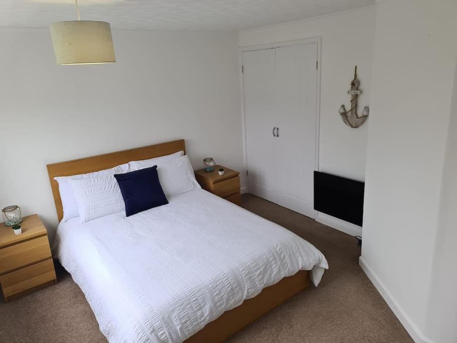 Tempat tidur dalam kamar di Beautiful 3 bed house in Hunstanton - near Searles with sea views