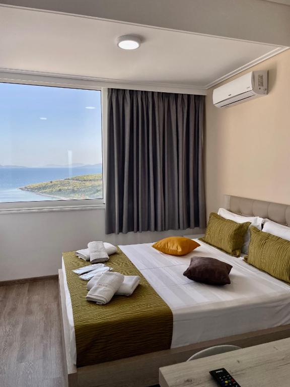 Postel nebo postele na pokoji v ubytování Relax Mea Hotel