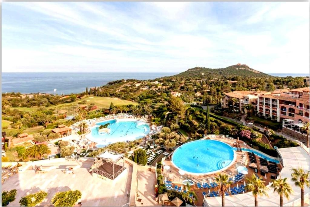 an aerial view of a resort with two pools at Le Hameau Cap Estérel in Valescure