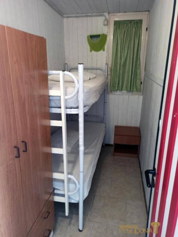 Postel nebo postele na pokoji v ubytování Camping Poseidonia