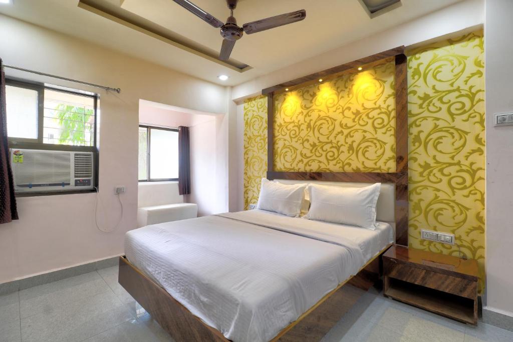 Ένα ή περισσότερα κρεβάτια σε δωμάτιο στο Hotel Anantha by WB Inn