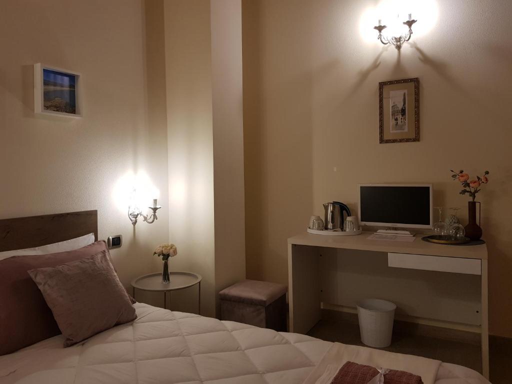 A bed or beds in a room at Grace dell'isola dei Coralli
