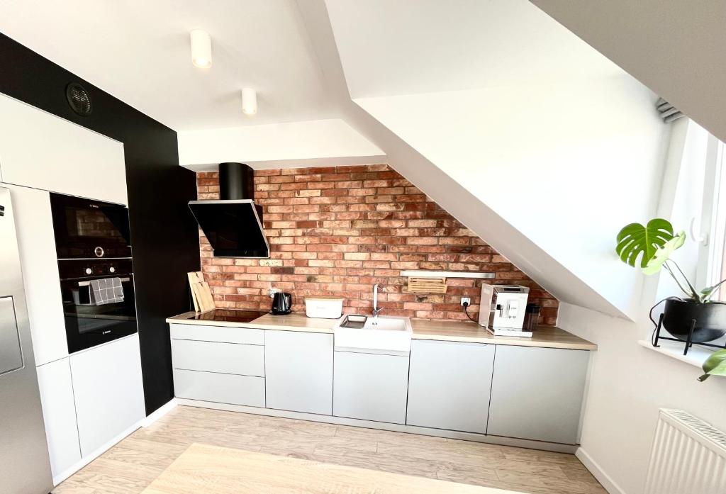 Kuchyň nebo kuchyňský kout v ubytování Ach to tu Apartament