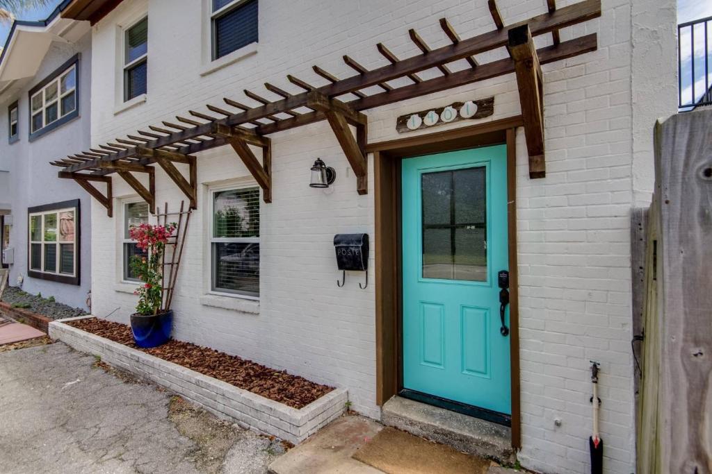 a front door of a house with a blue door at Sea Salt Townhome in Jacksonville Beach