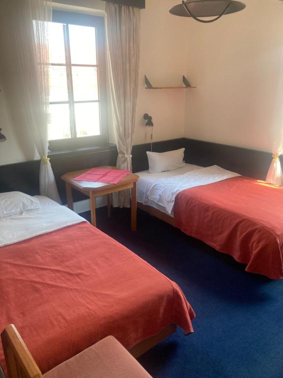 Postel nebo postele na pokoji v ubytování Penzion u Svatého Prokopa