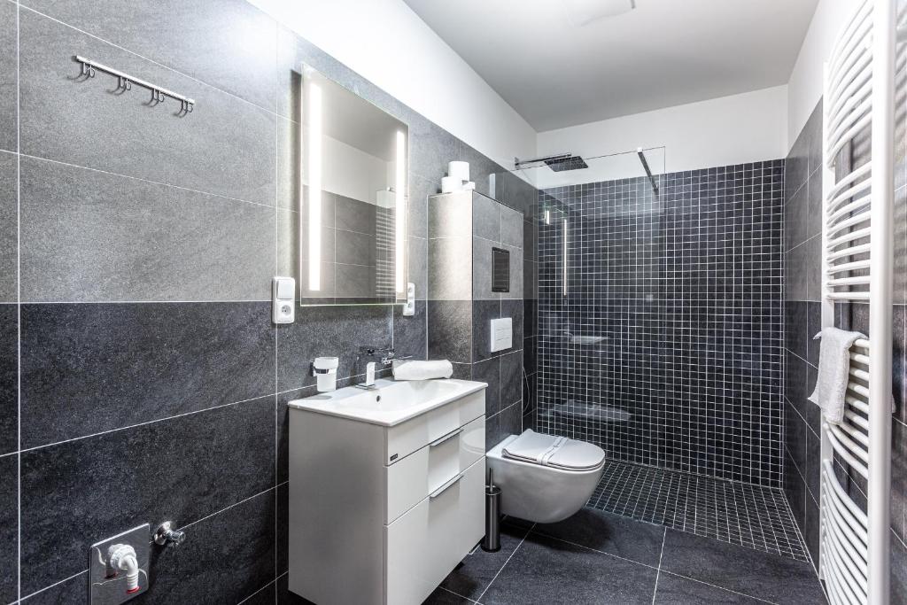 Koupelna v ubytování PLESSBERG Apartments Plešivec