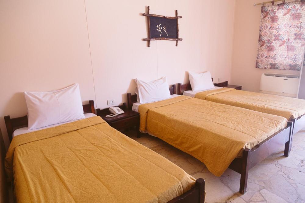 Кровать или кровати в номере Sayadeen Village - Red Sea Riviera