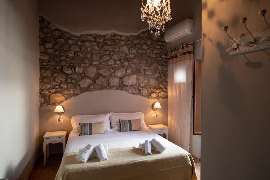 Postel nebo postele na pokoji v ubytování Hotel Borgo Vistalago