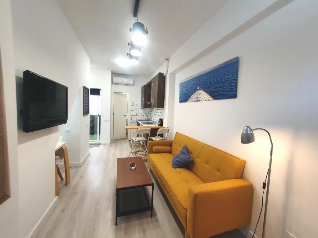 Зона вітальні в Apartamento moderno y acogedor.