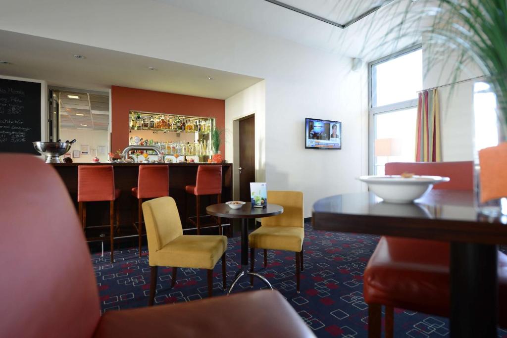 TV a/nebo společenská místnost v ubytování Livenwork Hotel & CoWorking GVZ Ingolstadt