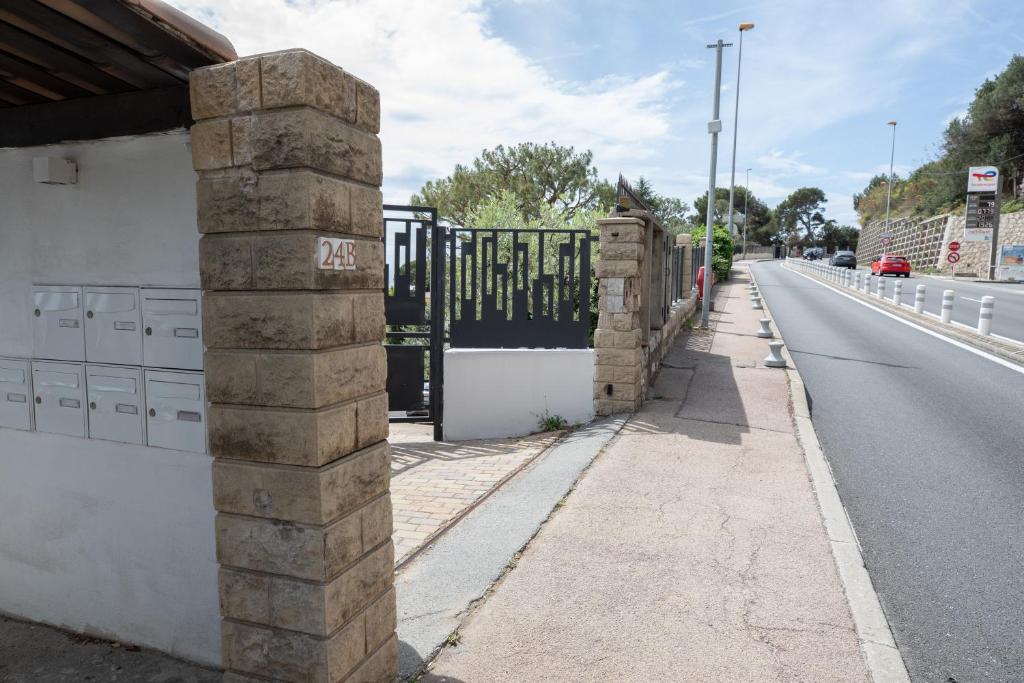 a gate on the side of a road at Mont des Olives - Cap D'ail- app4 in Saint-Antoine