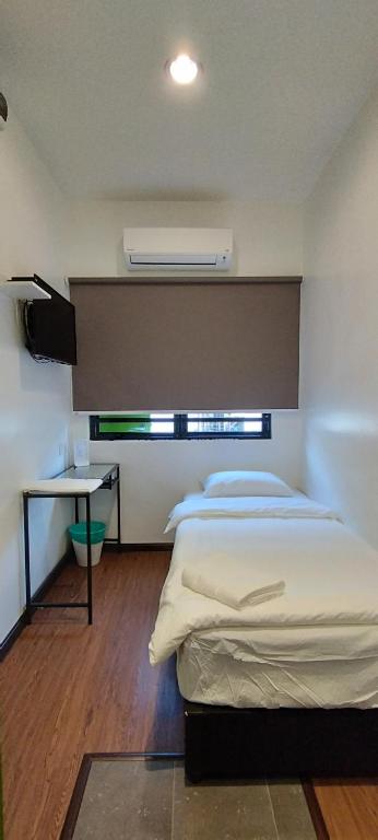Postel nebo postele na pokoji v ubytování Olive Bedz Hotel