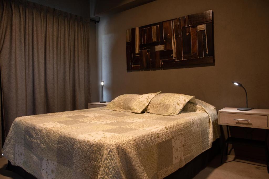 En eller flere senger på et rom på Complejo Piuquenes Lodge Valle de Uco
