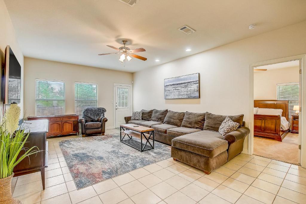 a living room with a couch and a piano at Granite Getaway in Granite Shoals
