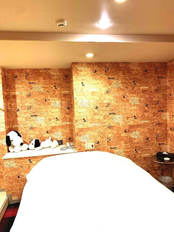 Łóżko lub łóżka w pokoju w obiekcie premium resort nagoya