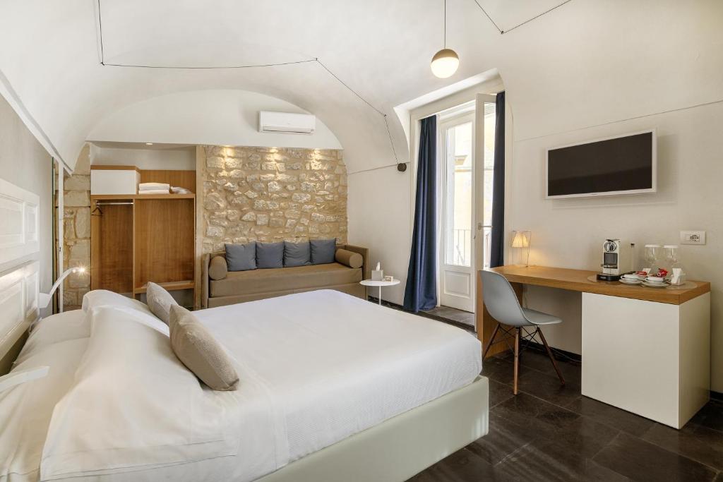 Postel nebo postele na pokoji v ubytování Iblaresort Boutique Hotel