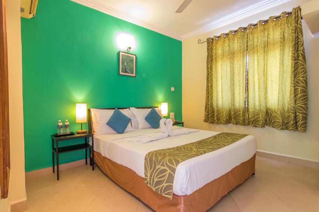 Postel nebo postele na pokoji v ubytování Aastha Escape Resort near Calangute Beach