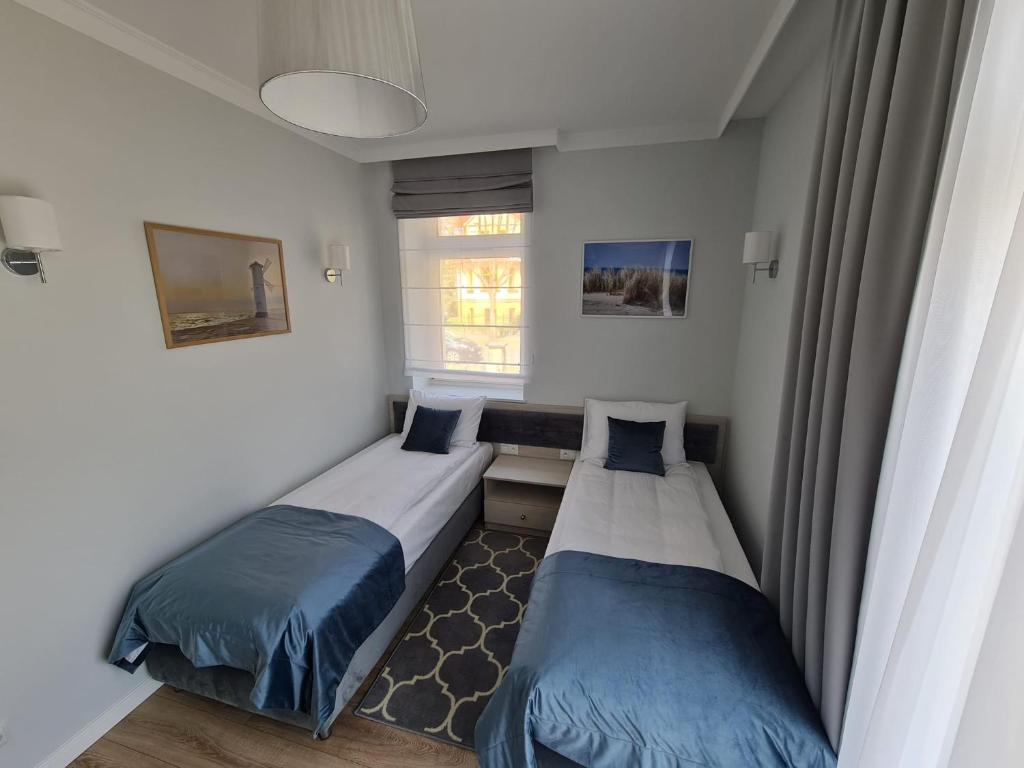 Posteľ alebo postele v izbe v ubytovaní Villa Babette - PARKING, Wi-Fi, sprzatanie - wszystko w cenie!