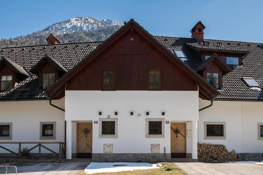 a large white building with brown roofs at Our Second Home in Kranjska Gora in Kranjska Gora