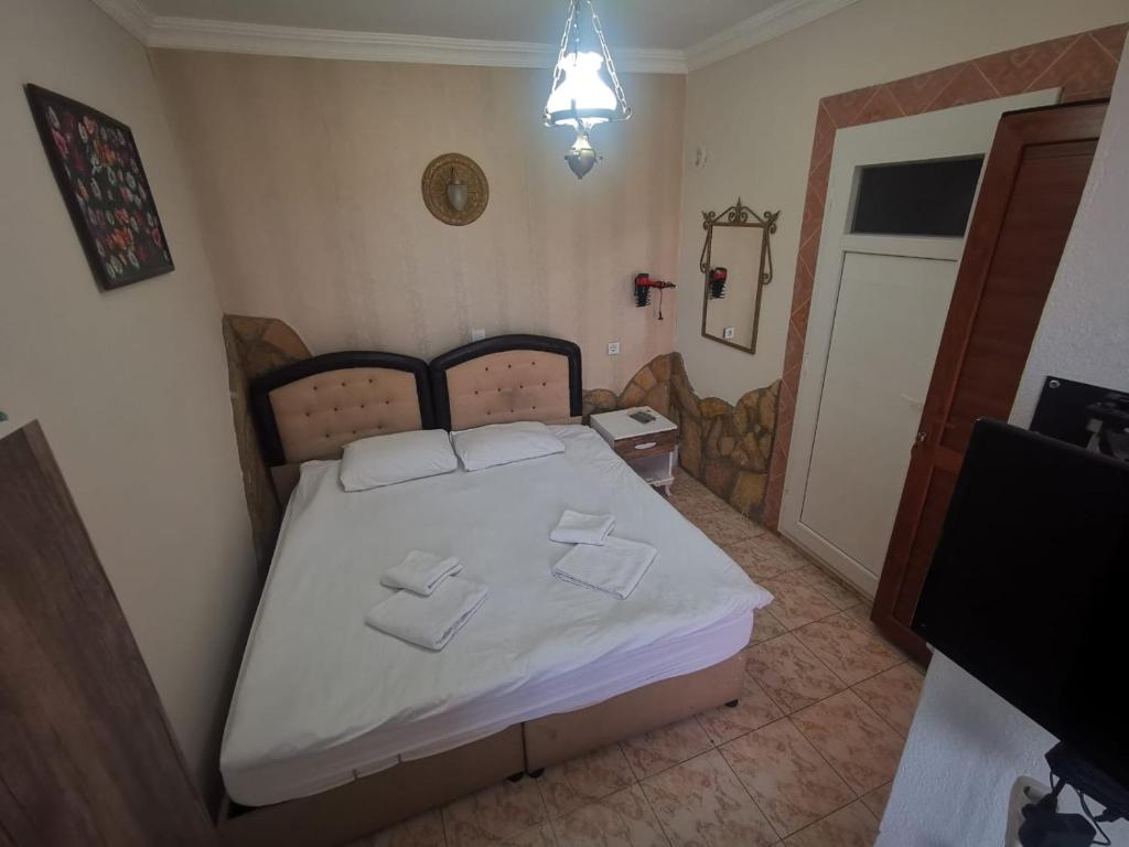 Postel nebo postele na pokoji v ubytování Anz Guest House Pansiyon
