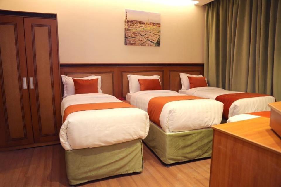 Postel nebo postele na pokoji v ubytování Al Bostan Al Masi Hotel