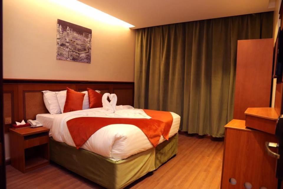 Postel nebo postele na pokoji v ubytování Al Bostan Al Masi Hotel