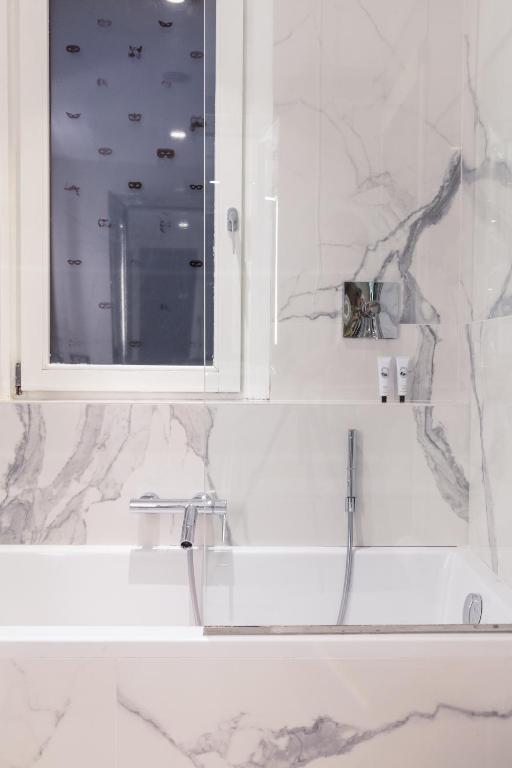 a bathroom with a sink and a mirror at Hotel Palazzina Grassi in Venice