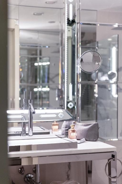 a bathroom with a sink and a mirror at Hotel Palazzina Grassi in Venice