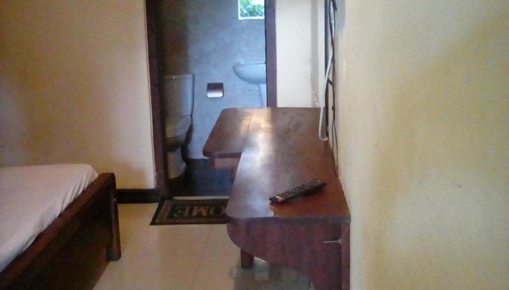 Postel nebo postele na pokoji v ubytování Leaf Guest House