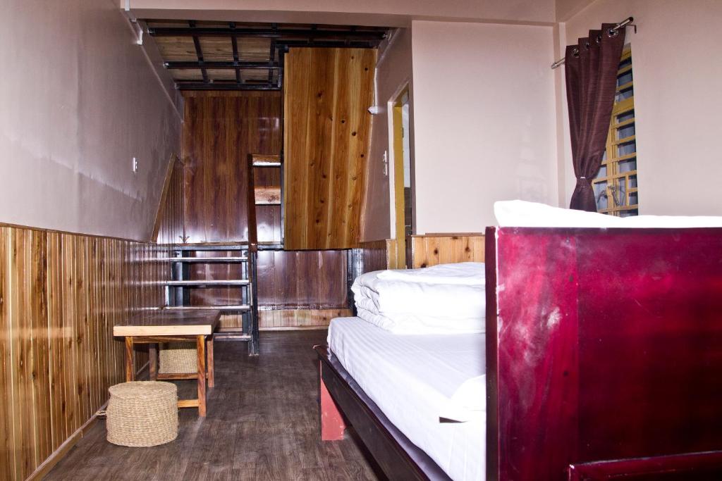 Postel nebo postele na pokoji v ubytování the DEW DROP HOME STAY