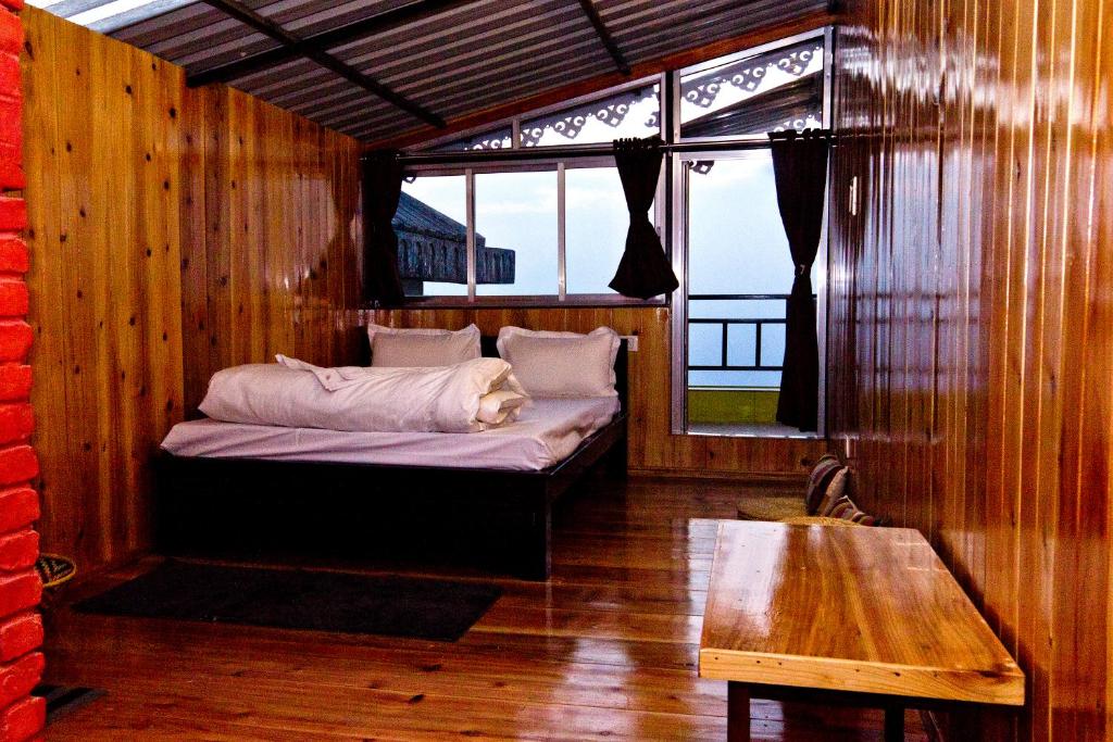 Postel nebo postele na pokoji v ubytování the DEW DROP HOME STAY