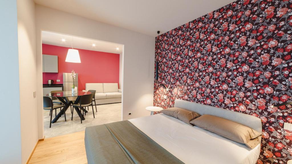 Ένα ή περισσότερα κρεβάτια σε δωμάτιο στο Vietti Apartments