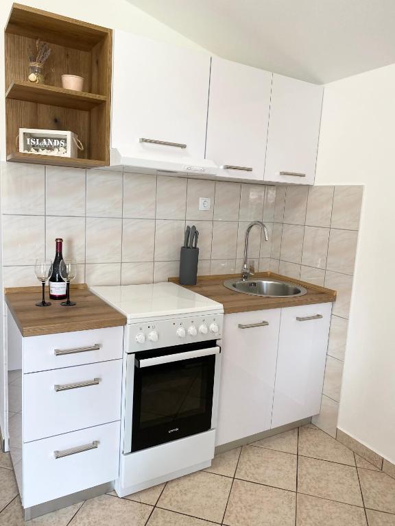 Kuchyňa alebo kuchynka v ubytovaní Apartments LucMar