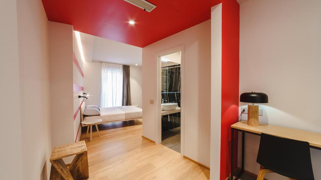 Ένα ή περισσότερα κρεβάτια σε δωμάτιο στο Vietti Apartments