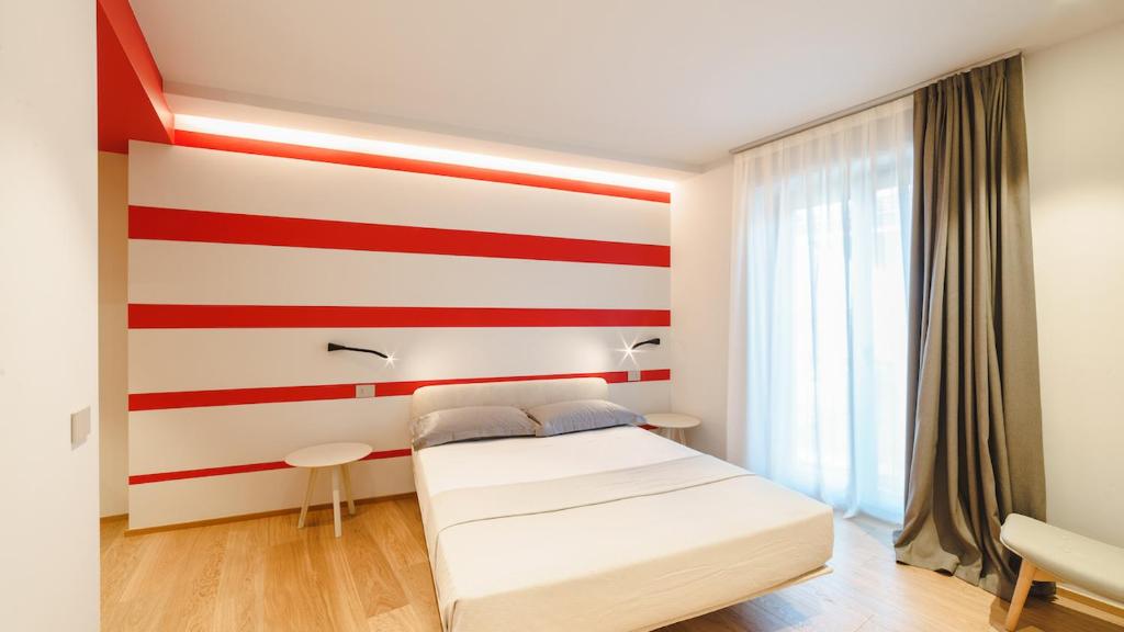 Ένα ή περισσότερα κρεβάτια σε δωμάτιο στο Vietti Apartments