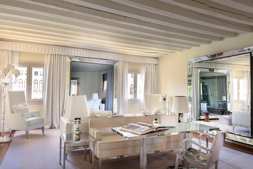a living room with a couch and a table at Hotel Palazzina Grassi in Venice