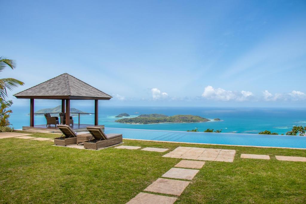 a villa with a gazebo and the ocean at Villa Salazie in Mahe