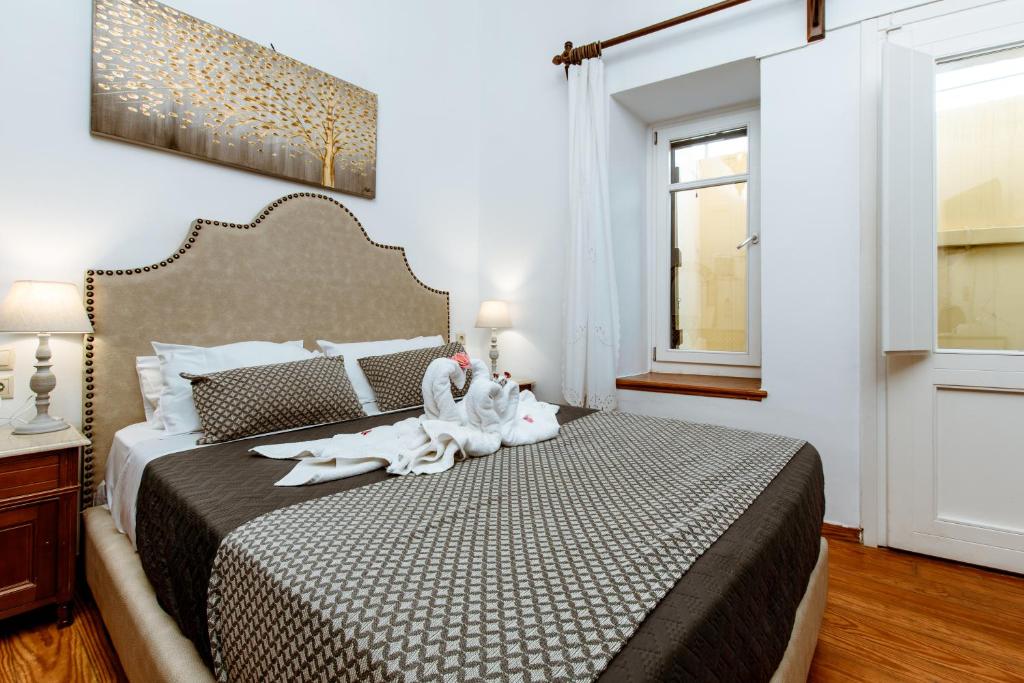 Postel nebo postele na pokoji v ubytování Bozzali Deluxe Hotel