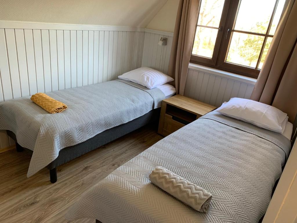 Postel nebo postele na pokoji v ubytování Keldrimäe külalistemaja