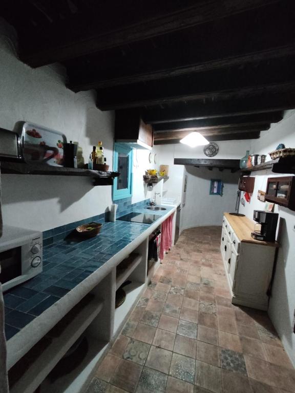 Kuchyň nebo kuchyňský kout v ubytování Can Pep Frit