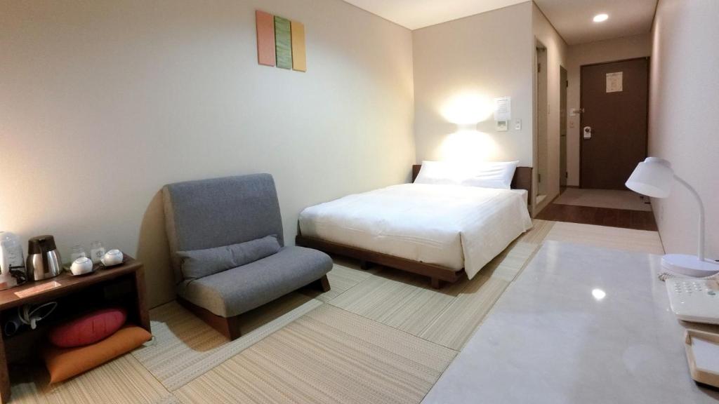 Ένα ή περισσότερα κρεβάτια σε δωμάτιο στο Honjo Grand Hotel / Vacation STAY 38640