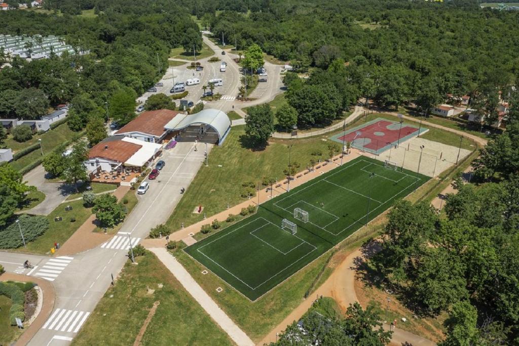 an aerial view of a park with a tennis court at Mobile Homes Banko in Bijela Uvala and Zelena laguna in Poreč