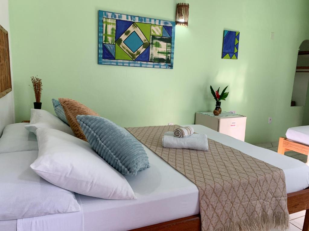 Cama ou camas em um quarto em Pousada Lanai