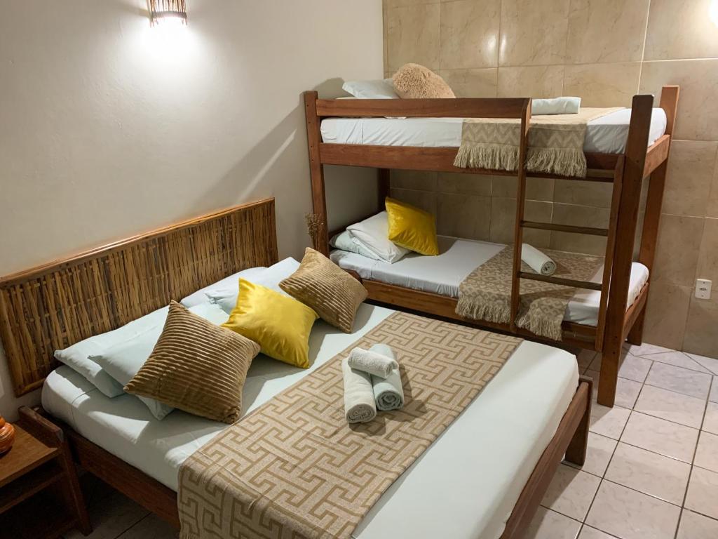 Cama ou camas em um quarto em Pousada Lanai