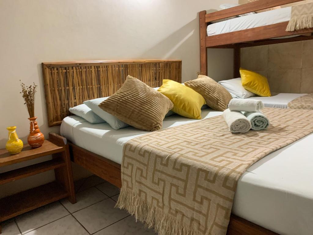 Cama ou camas em um quarto em Pousada Lanai