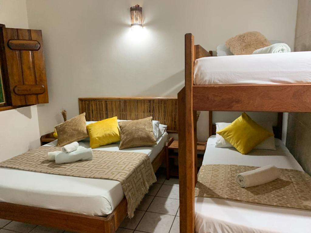 Cama ou camas em um quarto em Pousada Lanai