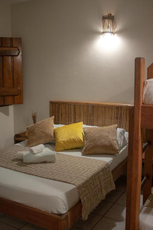 Cama ou camas em um quarto em Pousada Lanai