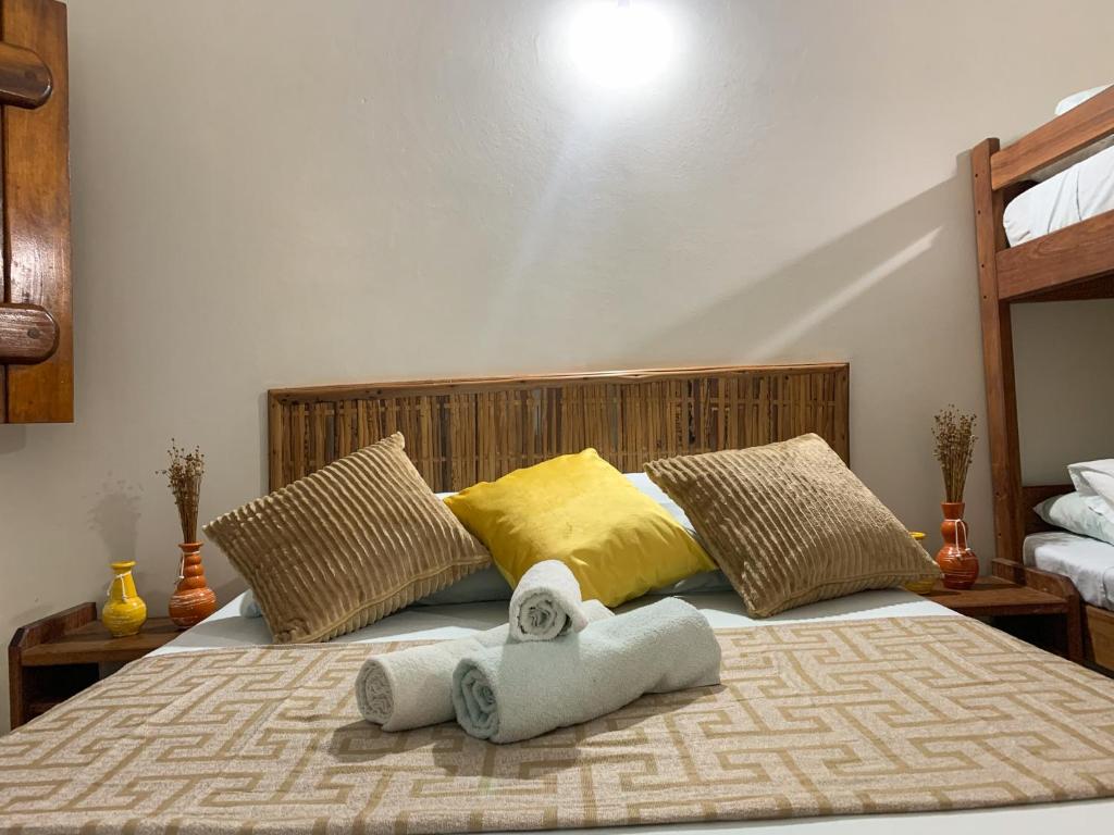 Cama ou camas em um quarto em Pousada Lanai