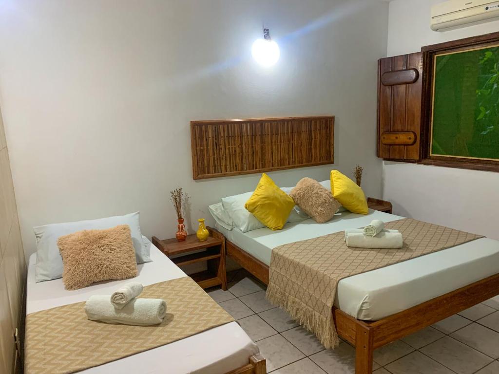 Cama ou camas em um quarto em Pousada Lanai