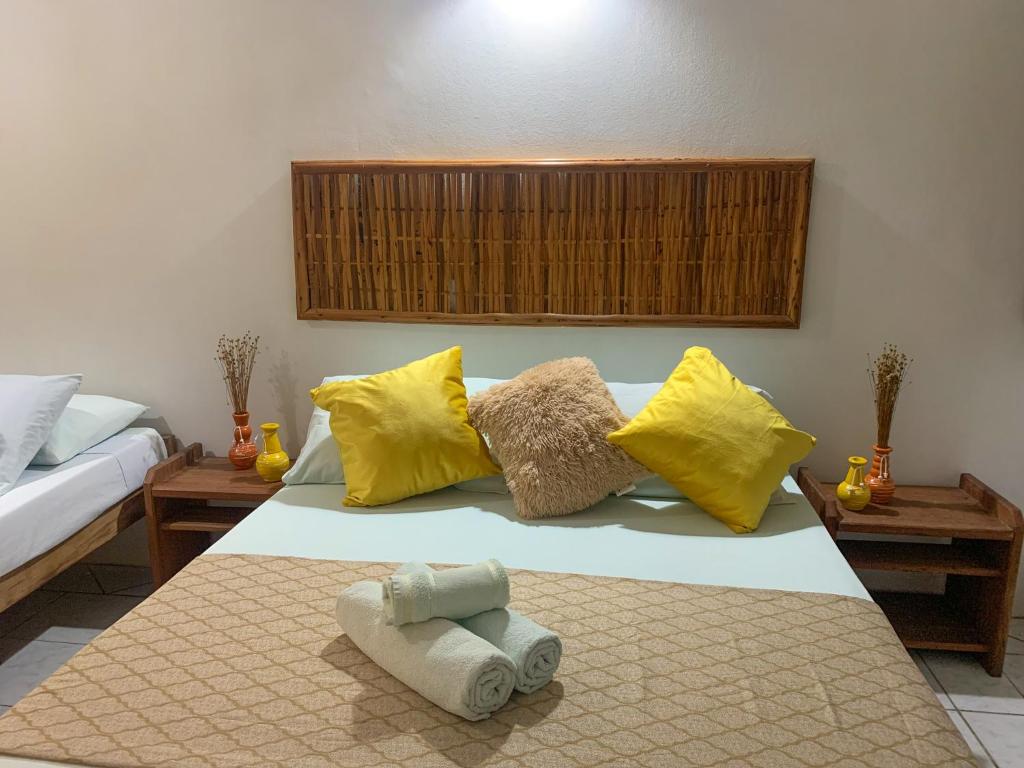 Cama ou camas em um quarto em Pousada Lanai